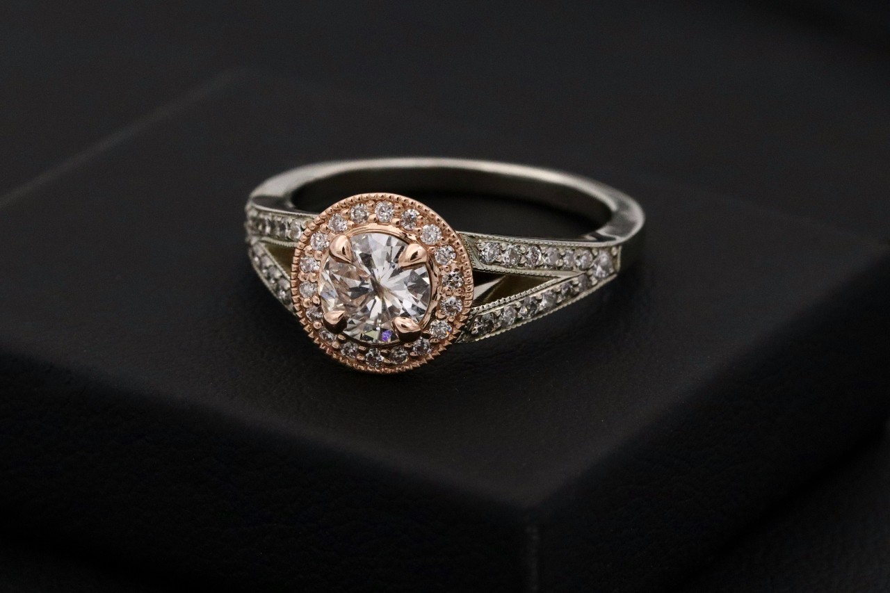 A mixed metal engagement ring with milgrain detailing A mixed metal engagement ring with milgrain detailing