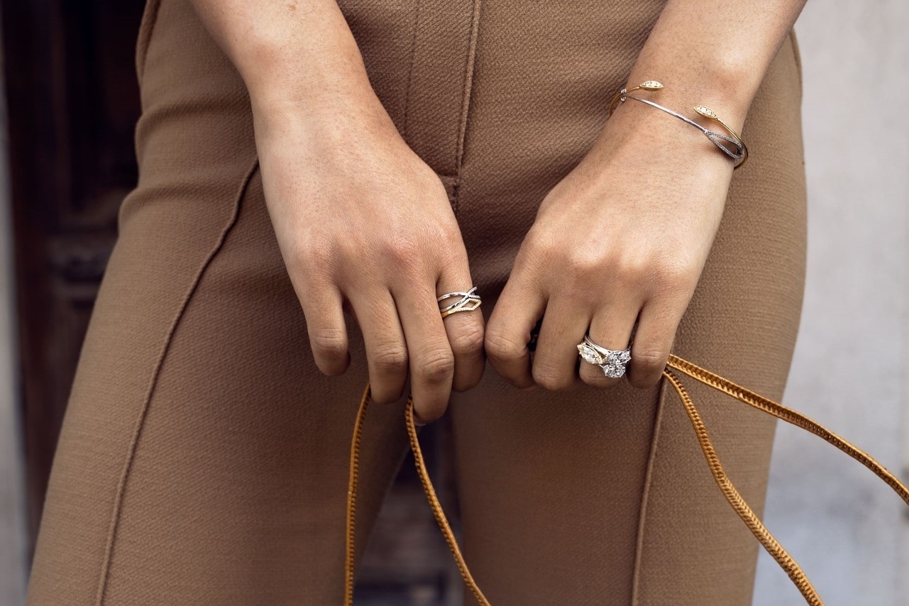 Lady holding a bag, wearing fashion rings on both hands Lady holding a bag, wearing fashion rings on both hands