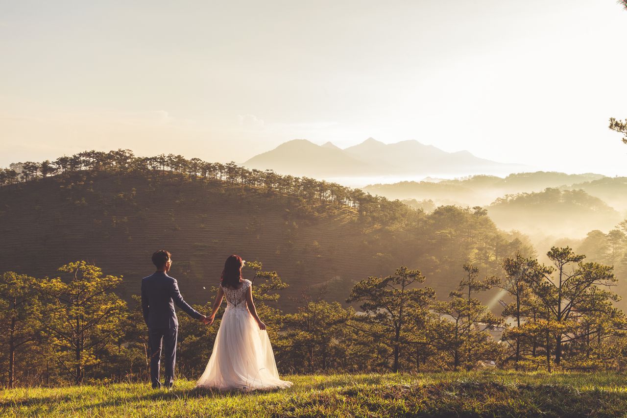 A newly married couple takes in the view after their wedding ceremony A newly married couple takes in the view after their wedding ceremony
