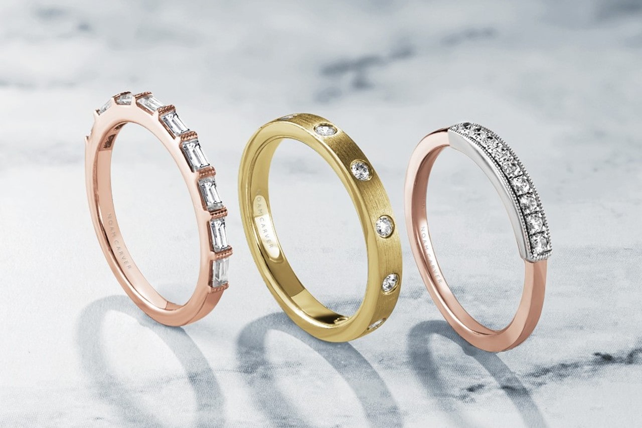 Three thin wedding bands set with differently cut diamonds Three thin wedding bands set with differently cut diamonds