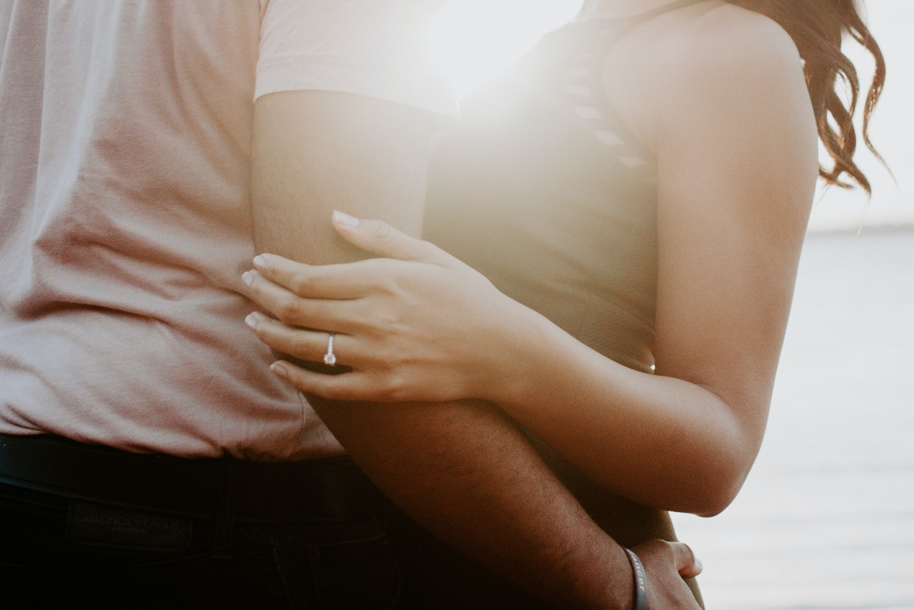 A couple embracing, wearing jewellery A couple embracing, wearing jewellery