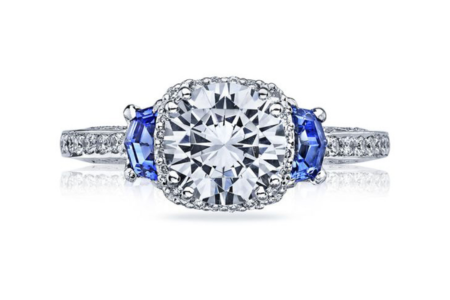 A TACORI three stone engagement ring with two sapphires around the centre stone, available at Prestige Jewellers.